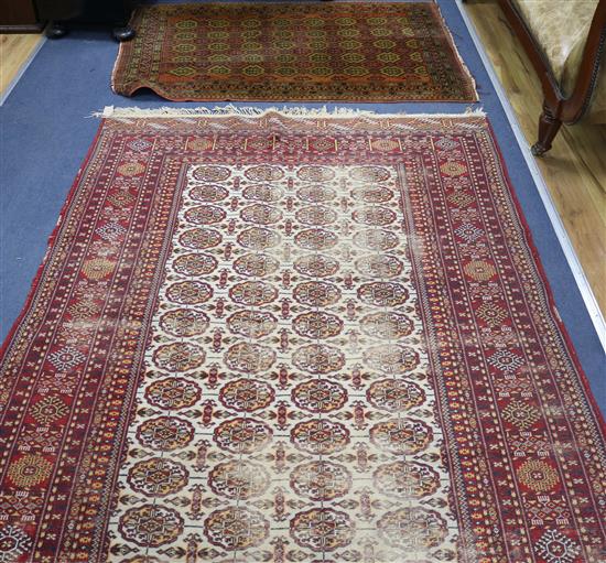 Red ground rug and a silk rug 272 x 146cm